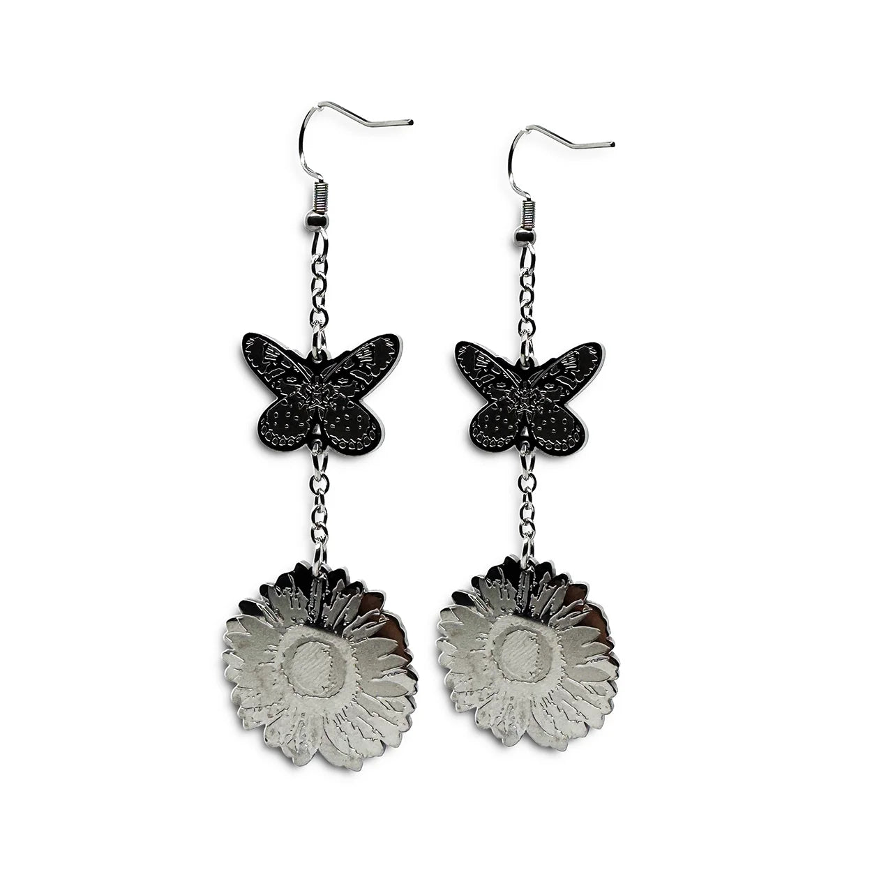 Close-up of Indie Ovation Butterfly & Sunflower earrings in stainless steel, 1-inch engraved nature design