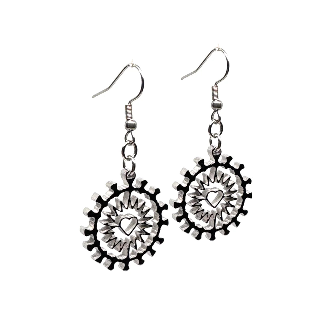 Close-up of Indie Ovation Corona Heart earrings in stainless steel, 1-inch geometric heart and corona design