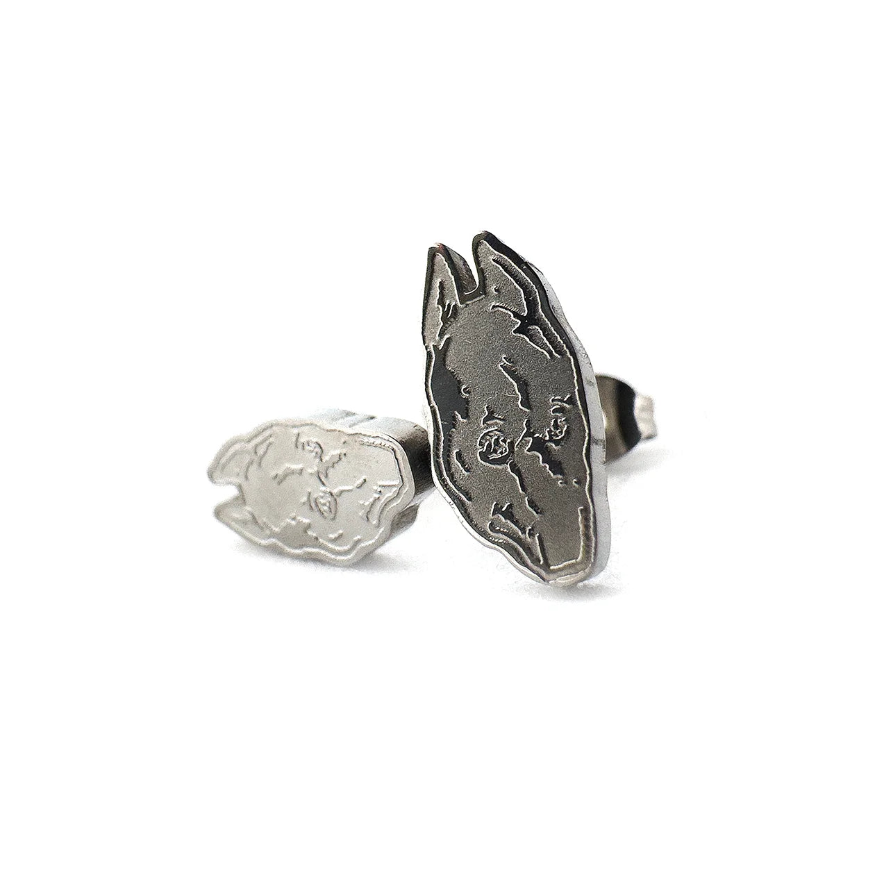 Compact 0.5-inch stainless steel stud earrings inspired by Death Grips' groundbreaking album The Money Store, perfect for fans of music merch.