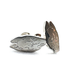 Compact 0.5-inch stainless steel stud earrings inspired by Death Grips' groundbreaking album The Money Store, perfect for fans of music merch.