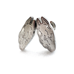 Compact 0.5-inch stainless steel stud earrings inspired by Death Grips' groundbreaking album The Money Store, perfect for fans of music merch.