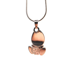 Close-up of polished stainless steel Drain Gang baby logo necklace pendant