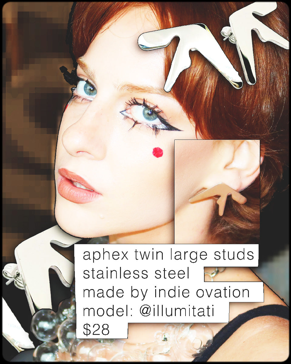 Girl (Illumitati) wearing Aphex Twin logo large stud earrings – 1.25-inch stainless steel statement accessory