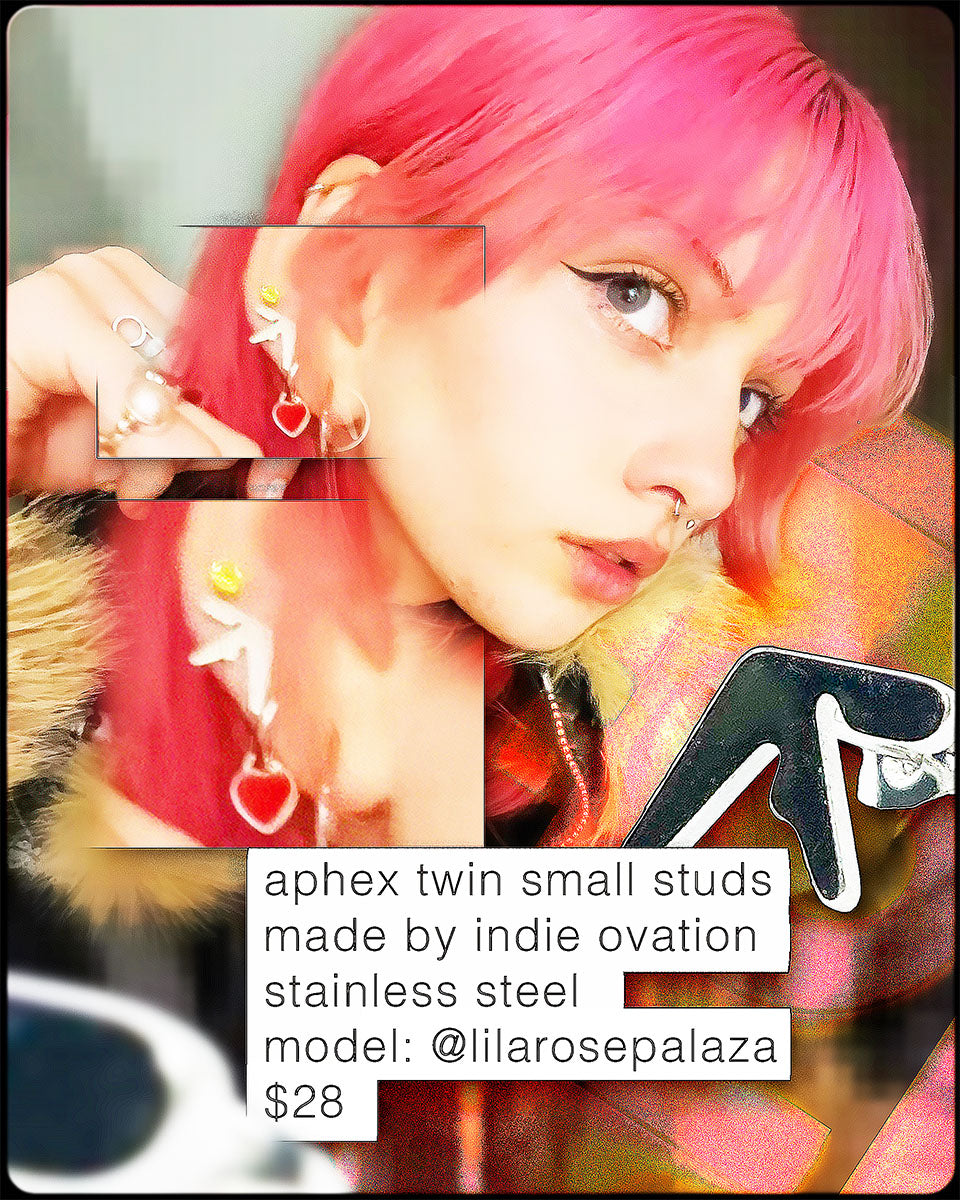 Girl wearing Aphex Twin logo small stud earrings – 0.5-inch stainless steel fan accessory