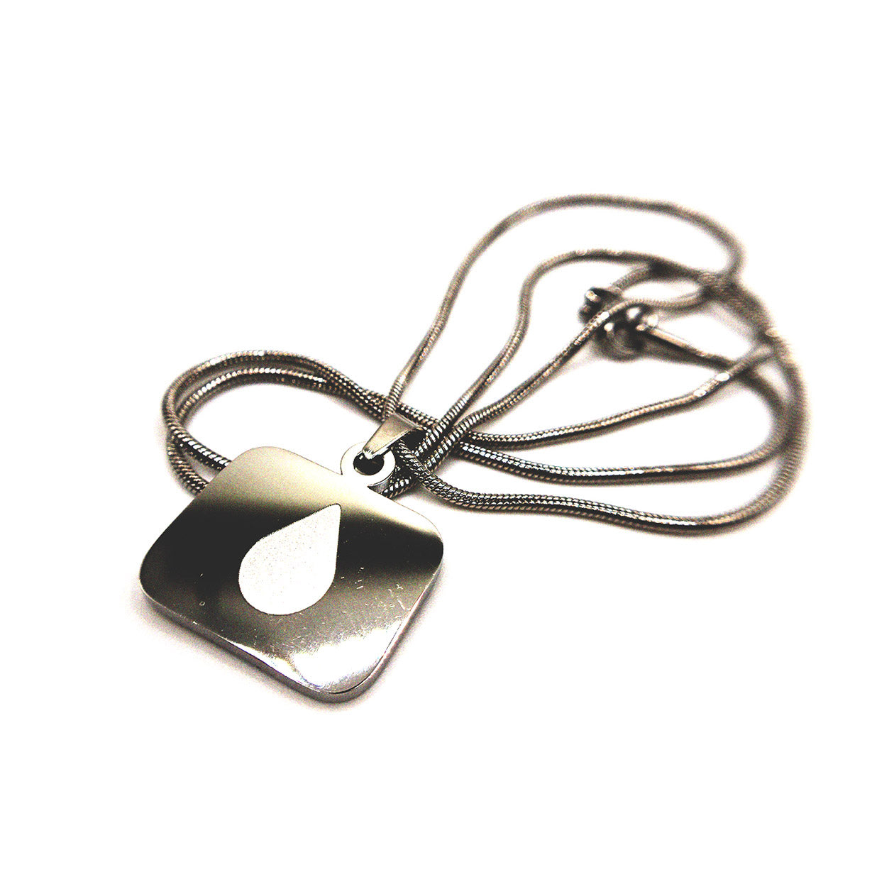 Polished stainless steel Lumon tear necklace with a minimalist drop logo on a square pendant