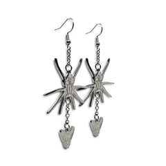 Close-up of Indie Ovation Spider & Fly earrings in stainless steel, 1.25-inch engraved gothic design