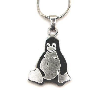 Stainless steel necklace with Tux the Linux penguin pendant on a chain, product photo on white background