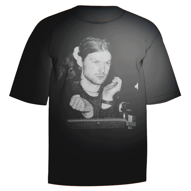 Flat-lay of a black Aphex Twin Portrait T-Shirt showcasing a striking stylized portrait of Richard D. James. Crafted from durable and breathable Comfort Colors 100% ringspun cotton for everyday wear. A stylish addition to any Aphex Twin fan’s collection.