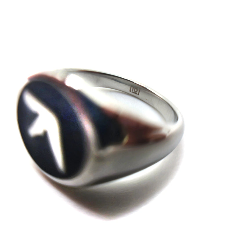 Close up of indie ovation logo on stainless steel silver ring with an Aphex Logo on a black circular base