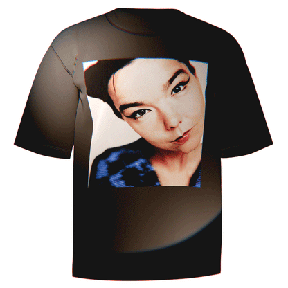 Flat-lay of a black Bjork Close Up T-Shirt featuring a detailed, striking close-up portrait of Bjork. Made from ultra-soft Comfort Colors 100% ringspun cotton for breathable comfort and a relaxed fit. A perfect addition for fans celebrating Bjork’s iconic beauty and artistry.