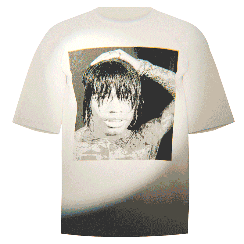 Flat-lay of a creme Ecco2k Selfie T-Shirt featuring an iconic selfie of the artist. Crafted from ultra-soft Comfort Colors 100% ringspun cotton for breathable comfort and a relaxed fit. Perfect for fans of Ecco2k’s visionary style and unique artistry.