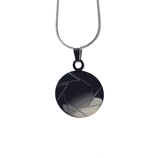 Spinning gif of a stainless steel aperture science logo necklace from Portal 2