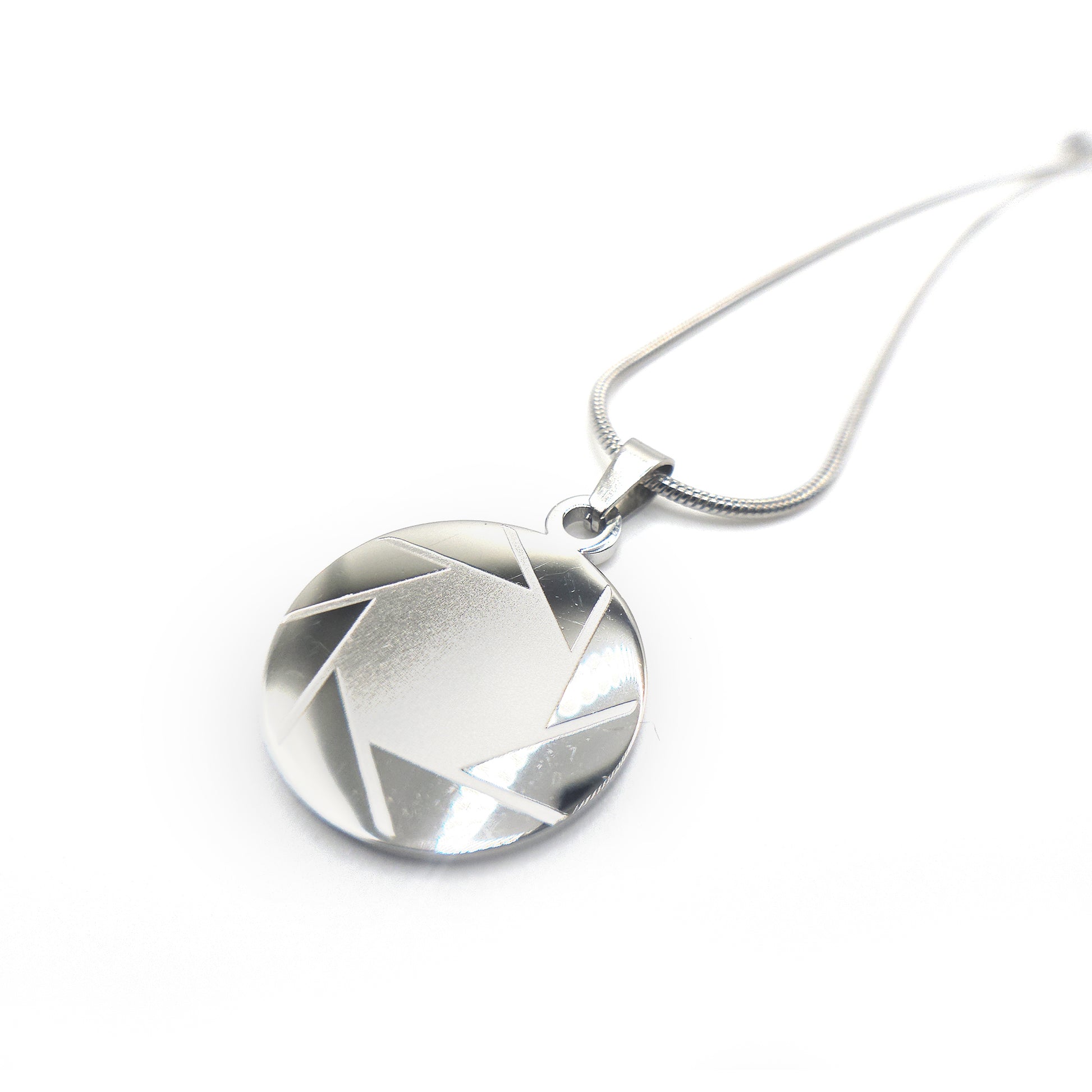 Silver geometric portal 2 aperture pendant necklace on a white background
